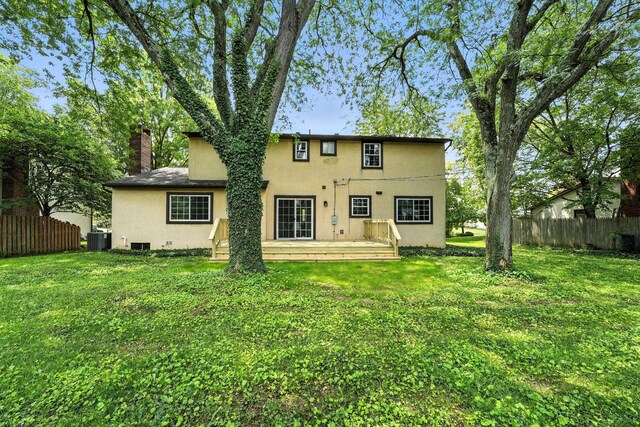 1360 Langston Dr, Columbus, OH 43220 - back of house with a wooden deck, stucco siding, and a chimney