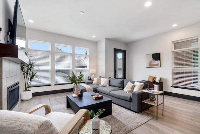 954 Hudson Xing, Columbus, OH 43212 - living room with a fireplace, recessed lighting, and light wood-style flooring