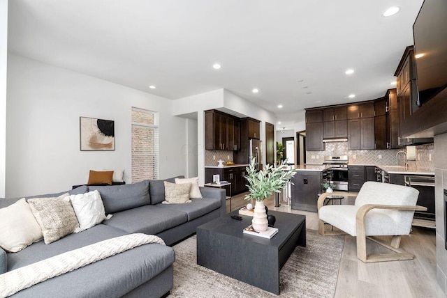 954 Hudson Xing, Columbus, OH 43212 - living area featuring light wood-type flooring and recessed lighting