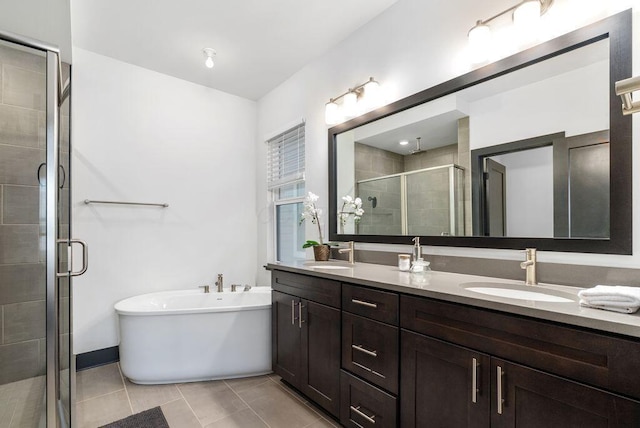 954 Hudson Xing, Columbus, OH 43212 - bathroom featuring a shower stall, double vanity, a freestanding bath, and tile patterned floors