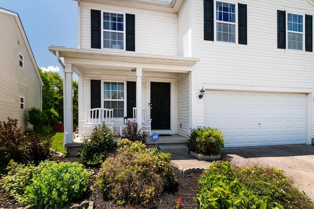 929 Preble Dr, Blacklick, OH 43004 - traditional-style house featuring a porch, a garage, and asphalt driveway