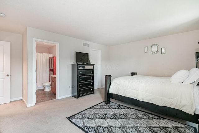 929 Preble Dr, Blacklick, OH 43004 - bedroom with light colored carpet and connected bathroom
