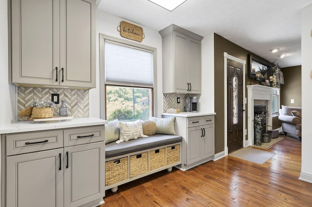 215 Barb Ct, Heath, OH 43056 - mudroom featuring light wood finished floors and a premium fireplace