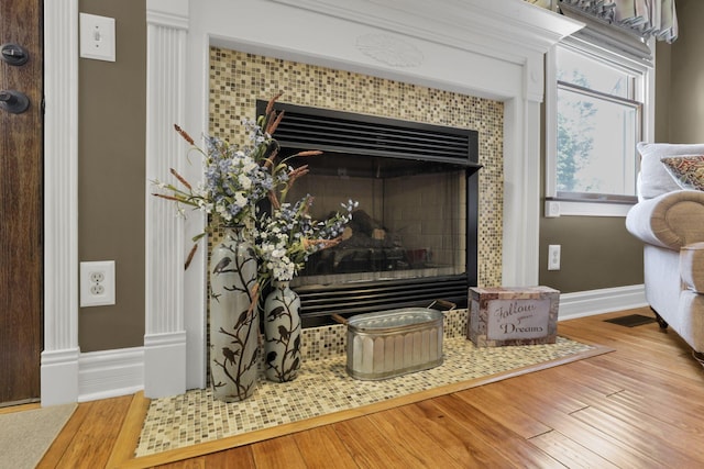 215 Barb Ct, Heath, OH 43056 - detailed view of wood finished floors and a tile fireplace