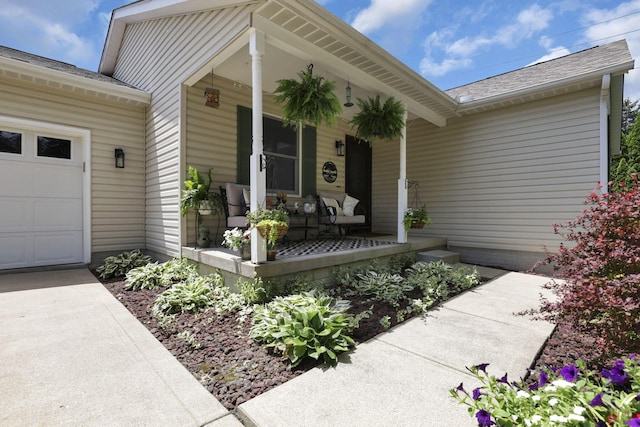 215 Barb Ct, Heath, OH 43056 - entrance to property featuring a porch, an attached garage, and roof with shingles