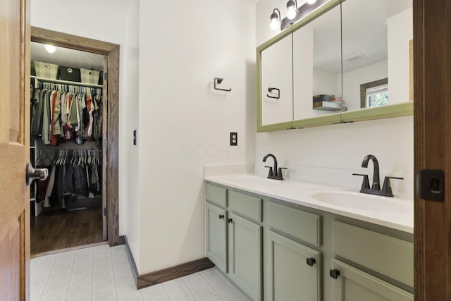 215 Barb Ct, Heath, OH 43056 - bathroom with double vanity, tile patterned floors, and a walk in closet