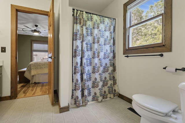 215 Barb Ct, Heath, OH 43056 - full bath with tile patterned floors, ensuite bath, curtained shower, and a ceiling fan