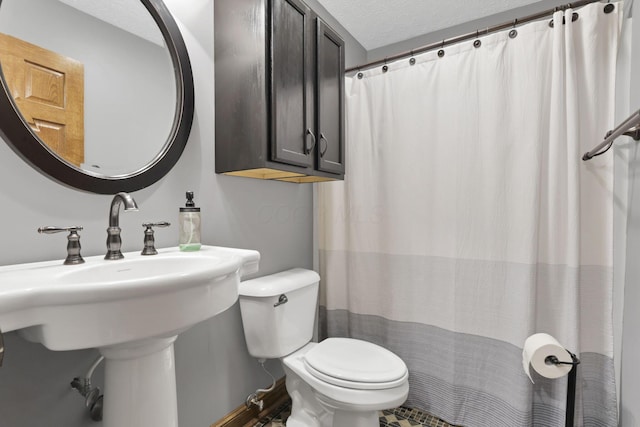 215 Barb Ct, Heath, OH 43056 - bathroom with a textured ceiling and a shower with shower curtain
