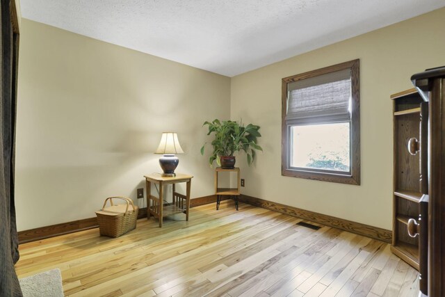 215 Barb Ct, Heath, OH 43056 - sitting room with baseboards and hardwood / wood-style flooring