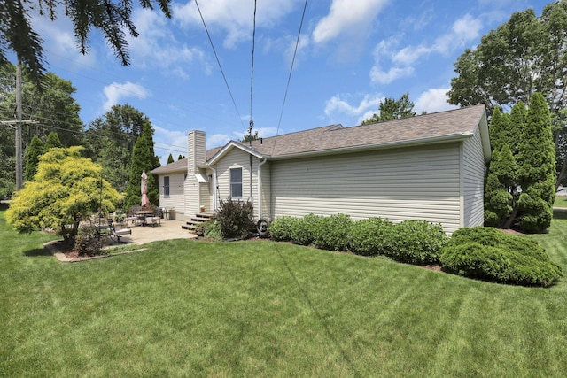 215 Barb Ct, Heath, OH 43056 - rear view of house with a patio area, a yard, and roof with shingles