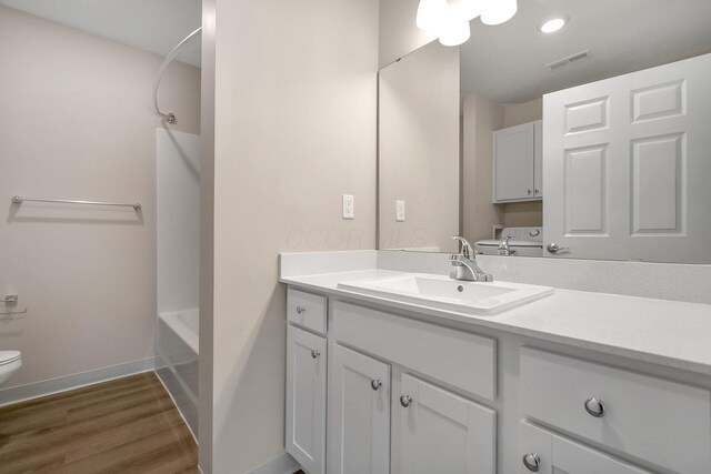 752 Whitetail Lp, Newark, OH 43055 - full bathroom featuring vanity, wood finished floors, and tub / shower combination