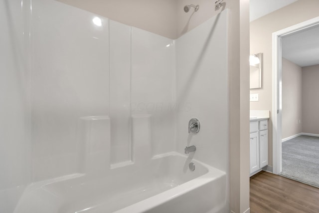 752 Whitetail Lp, Newark, OH 43055 - bathroom featuring shower / bathtub combination, wood finished floors, and vanity