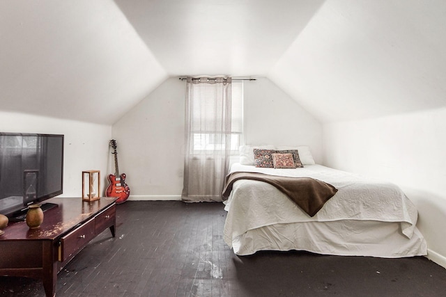 794 E Brighton Rd, Columbus, OH 43224 - bedroom with dark wood-style floors and lofted ceiling