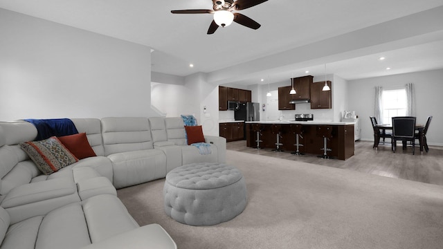 336 Onyx Ln, Delaware, OH 43015 - living room with recessed lighting, ceiling fan, and light wood finished floors