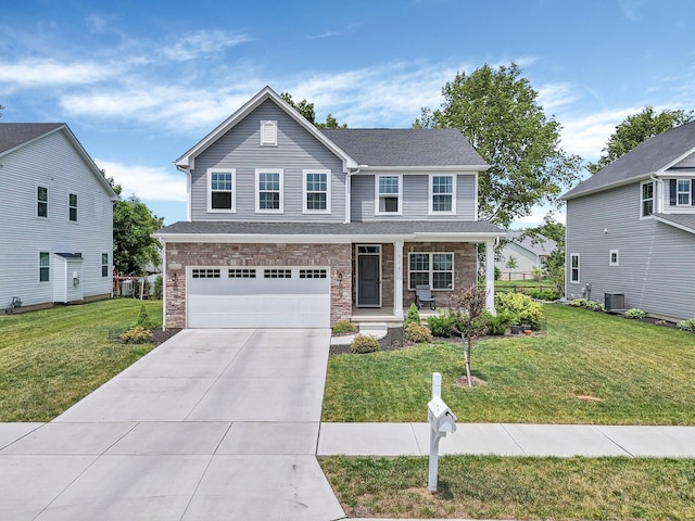 336 Onyx Ln, Delaware, OH 43015 - traditional-style home featuring covered porch, a garage, driveway, and a front yard
