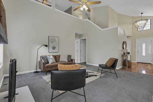2375 Oakthorpe Dr, Hilliard, OH 43026 - carpeted living room featuring high vaulted ceiling, a chandelier, and a ceiling fan