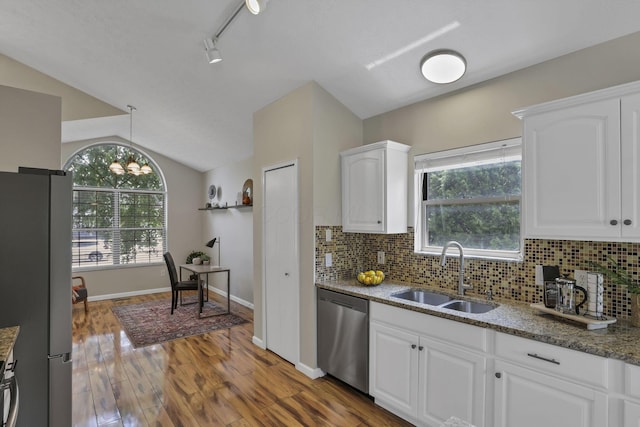2375 Oakthorpe Dr, Hilliard, OH 43026 - kitchen with stainless steel appliances, light stone countertops, wood finished floors, white cabinets, and backsplash