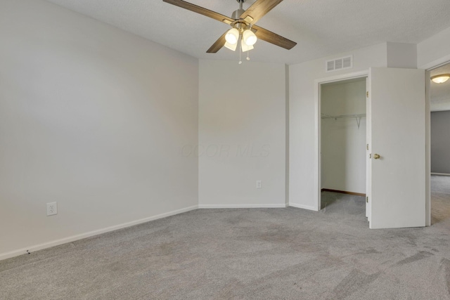2375 Oakthorpe Dr, Hilliard, OH 43026 - unfurnished bedroom with carpet floors, a walk in closet, a closet, and ceiling fan