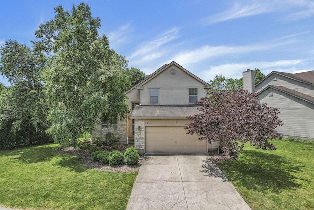2375 Oakthorpe Dr, Hilliard, OH 43026 - view of front of house featuring a garage, concrete driveway, a front lawn, and stone siding