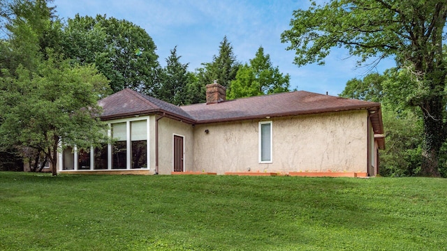 2830 Silver St, Granville, OH 43023 - rear view of property with stucco siding, a lawn, and a chimney