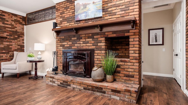 2830 Silver St, Granville, OH 43023 - living area with ornamental molding, wood finished floors, and a fireplace