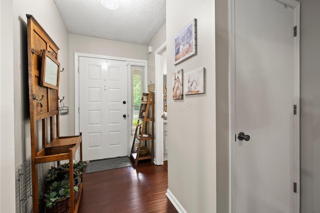 3903 Inverness Cir, Dublin, OH 43016 - entrance foyer featuring dark wood-style floors and a textured ceiling