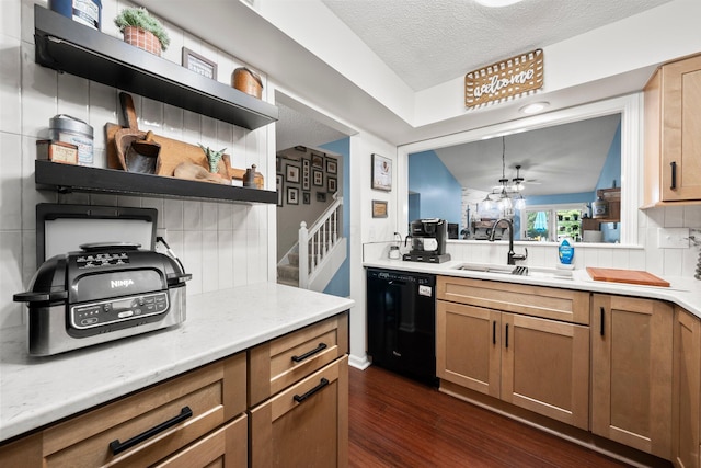 3903 Inverness Cir, Dublin, OH 43016 - kitchen featuring black dishwasher, dark wood-type flooring, light countertops, brown cabinets, and a textured ceiling