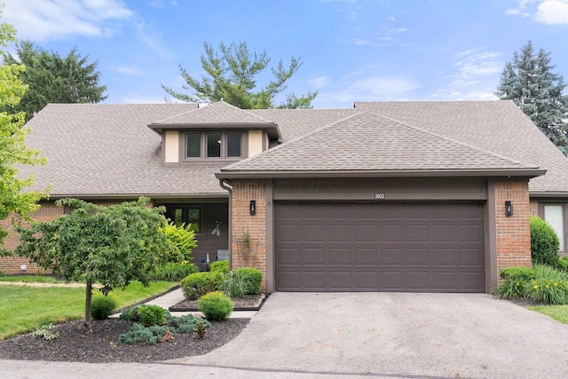 3903 Inverness Cir, Dublin, OH 43016 - view of front of house featuring brick siding, a garage, and a shingled roof