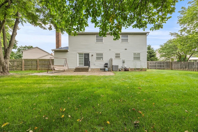 5681 Mcbride Ct, Dublin, OH 43016 - rear view of house with a patio area, entry steps, a fenced backyard, and a chimney