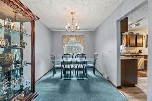 5681 Mcbride Ct, Dublin, OH 43016 - dining space with a chandelier and a textured ceiling