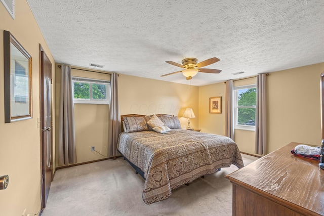 5681 Mcbride Ct, Dublin, OH 43016 - bedroom with light colored carpet, a textured ceiling, and ceiling fan