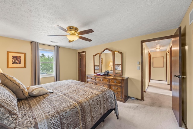 5681 Mcbride Ct, Dublin, OH 43016 - bedroom featuring light carpet, a textured ceiling, and a ceiling fan