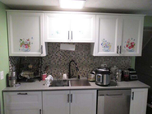 1881 Brimfield Rd, Columbus, OH 43229 - kitchen with dishwasher, white cabinets, tasteful backsplash, and light countertops