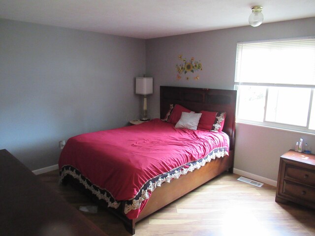 1881 Brimfield Rd, Columbus, OH 43229 - bedroom with baseboards and wood finished floors