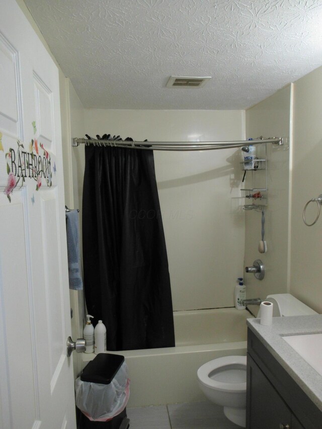 1881 Brimfield Rd, Columbus, OH 43229 - full bath with vanity, shower / bath combo with shower curtain, a textured ceiling, and tile patterned flooring