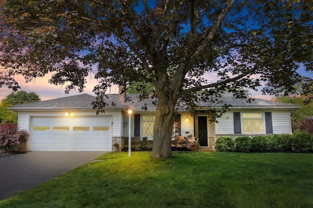 3287 Leighton Rd, Columbus, OH 43221 - view of front of home featuring driveway, a garage, and a front yard