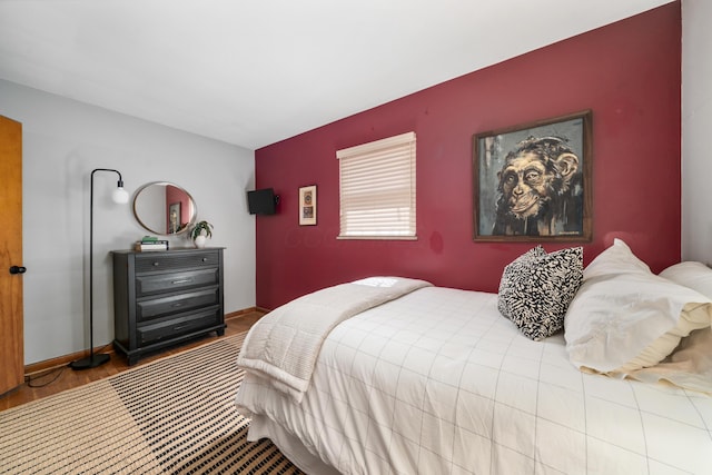 3287 Leighton Rd, Columbus, OH 43221 - bedroom with an accent wall and wood finished floors