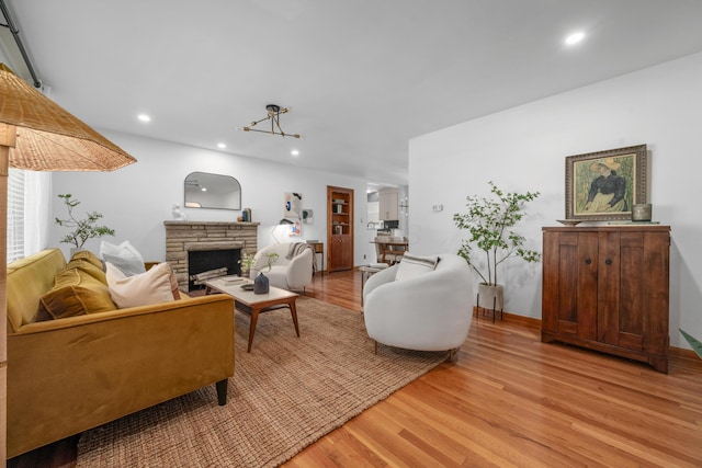 3287 Leighton Rd, Columbus, OH 43221 - living room with light wood-style floors, a fireplace, and recessed lighting