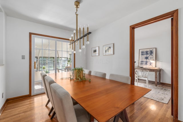 3287 Leighton Rd, Columbus, OH 43221 - dining area featuring light wood-type flooring and a chandelier