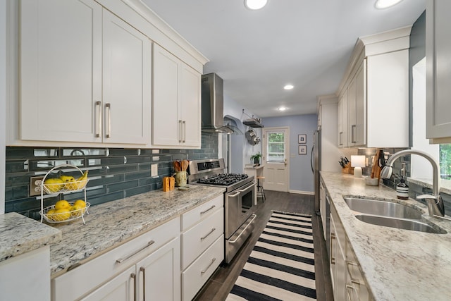 3287 Leighton Rd, Columbus, OH 43221 - kitchen featuring stainless steel gas stove, wall chimney range hood, dark wood finished floors, backsplash, and recessed lighting