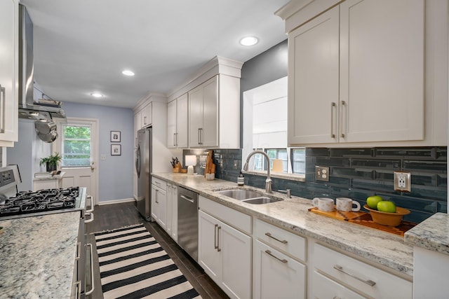 3287 Leighton Rd, Columbus, OH 43221 - kitchen with stainless steel appliances, white cabinetry, decorative backsplash, and recessed lighting