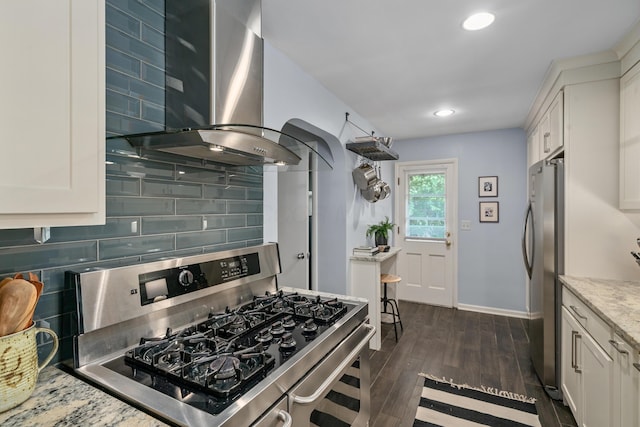3287 Leighton Rd, Columbus, OH 43221 - kitchen with stainless steel appliances, range hood, decorative backsplash, light stone counters, and dark wood-style floors