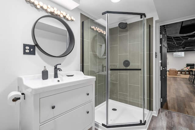 3287 Leighton Rd, Columbus, OH 43221 - full bath with vanity, a shower stall, and wood finished floors