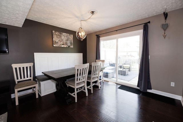 3790 Hunting Ln, Columbus, OH 43230 - dining space featuring a textured ceiling, dark wood-type flooring, and a chandelier