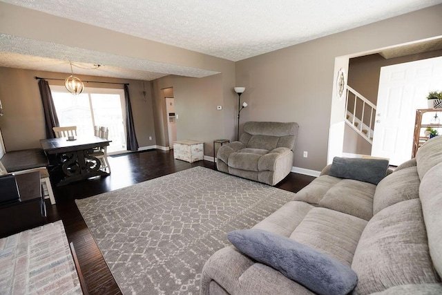 3790 Hunting Ln, Columbus, OH 43230 - living area with a textured ceiling, dark wood-style flooring, and stairway