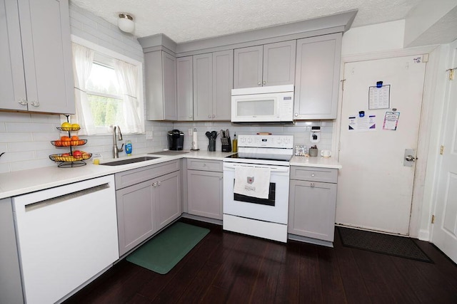 3790 Hunting Ln, Columbus, OH 43230 - kitchen with white appliances, gray cabinetry, tasteful backsplash, and a textured ceiling