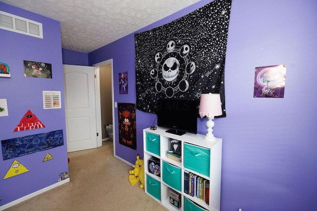 3790 Hunting Ln, Columbus, OH 43230 - recreation room featuring carpet flooring and a textured ceiling