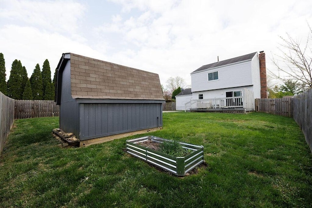 3790 Hunting Ln, Columbus, OH 43230 - fenced backyard with a shed, a vegetable garden, and a wooden deck