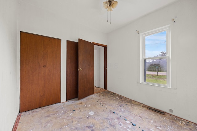 1716 Homer Rd NW, Utica, OH 43080 - unfurnished bedroom featuring multiple closets and a ceiling fan