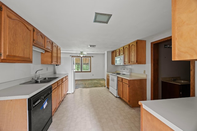 1716 Homer Rd NW, Utica, OH 43080 - kitchen featuring white appliances, light countertops, light flooring, and brown cabinetry